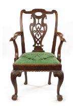 AN 18TH CENTURY WALNUT OPEN ARM CHAIR