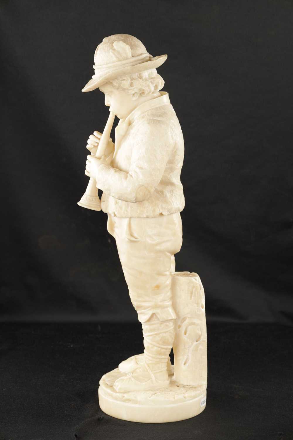 A 19TH CENTURY CARVED ALABASTER FIGURE OF A BOY PLAYING AN INSTRUMENT - Image 6 of 9