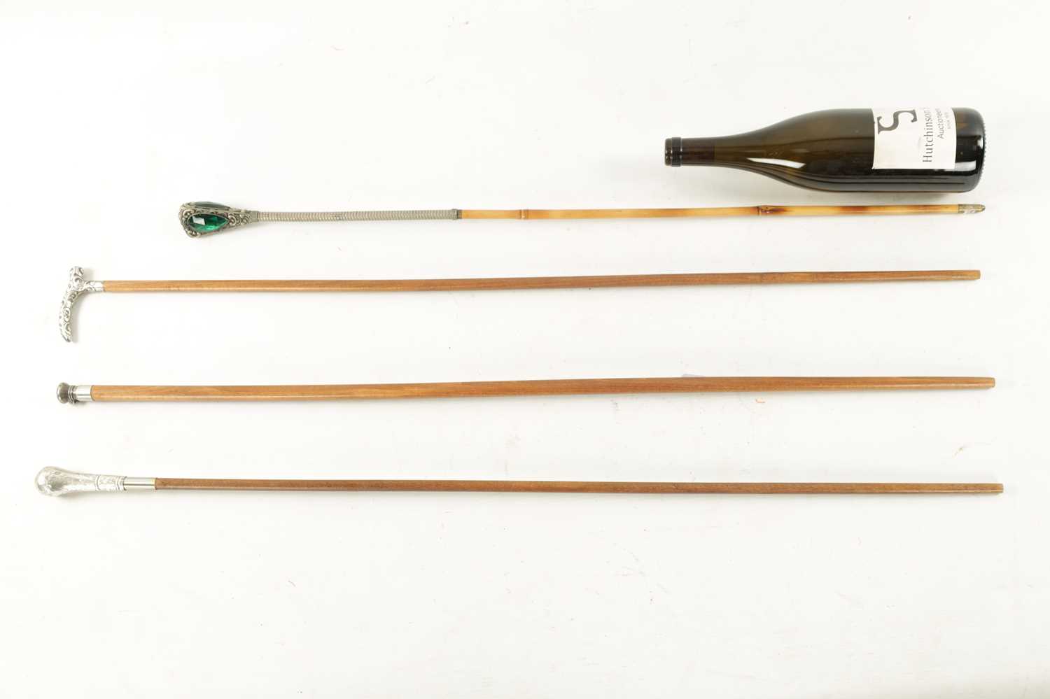 A COLLECTION OF FOUR LATE 19TH CENTURY SILVER AND WHITE METAL TOPPED WALKING STICKS - Image 5 of 6