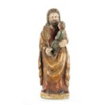 AN EARLY 18TH CENTURY SPANISH CARVED FIGURE OF MOSES WITH CHILD