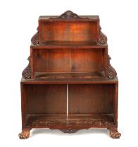 A SMALL REGENCY SIMULATED MAHOGANY STEPPED OPEN BOOKCASE