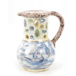 AN 18TH CENTURY DUTCH DELFTWARE PUZZLE JUG