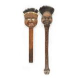 TWO UNUSUAL EARLY 20TH CENTURY CARVED WOOD LONG-HANDLED COMICAL BRUSHES