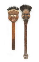 TWO UNUSUAL EARLY 20TH CENTURY CARVED WOOD LONG-HANDLED COMICAL BRUSHES