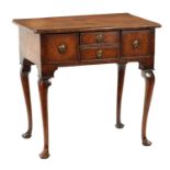 A QUEEN ANNE FIGURED WALNUT LOWBOY