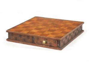 A 19TH CENTURY CARVED WOOD DOUBLE SIDED CHESS BOARD