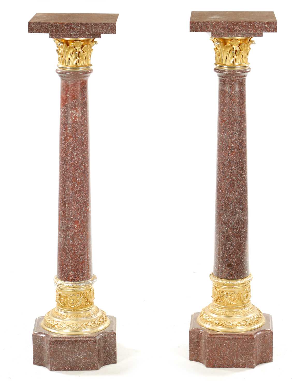 A PAIR OF 20TH CENTURY PORPHYRY TYPE AND ORMOLU MOUNTED COLUMNS