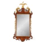 A GOOD GEORGE III MAHOGANY AND PARCEL GILT HANGING MIRROR