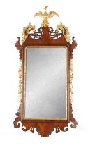 A GOOD GEORGE III MAHOGANY AND PARCEL GILT HANGING MIRROR