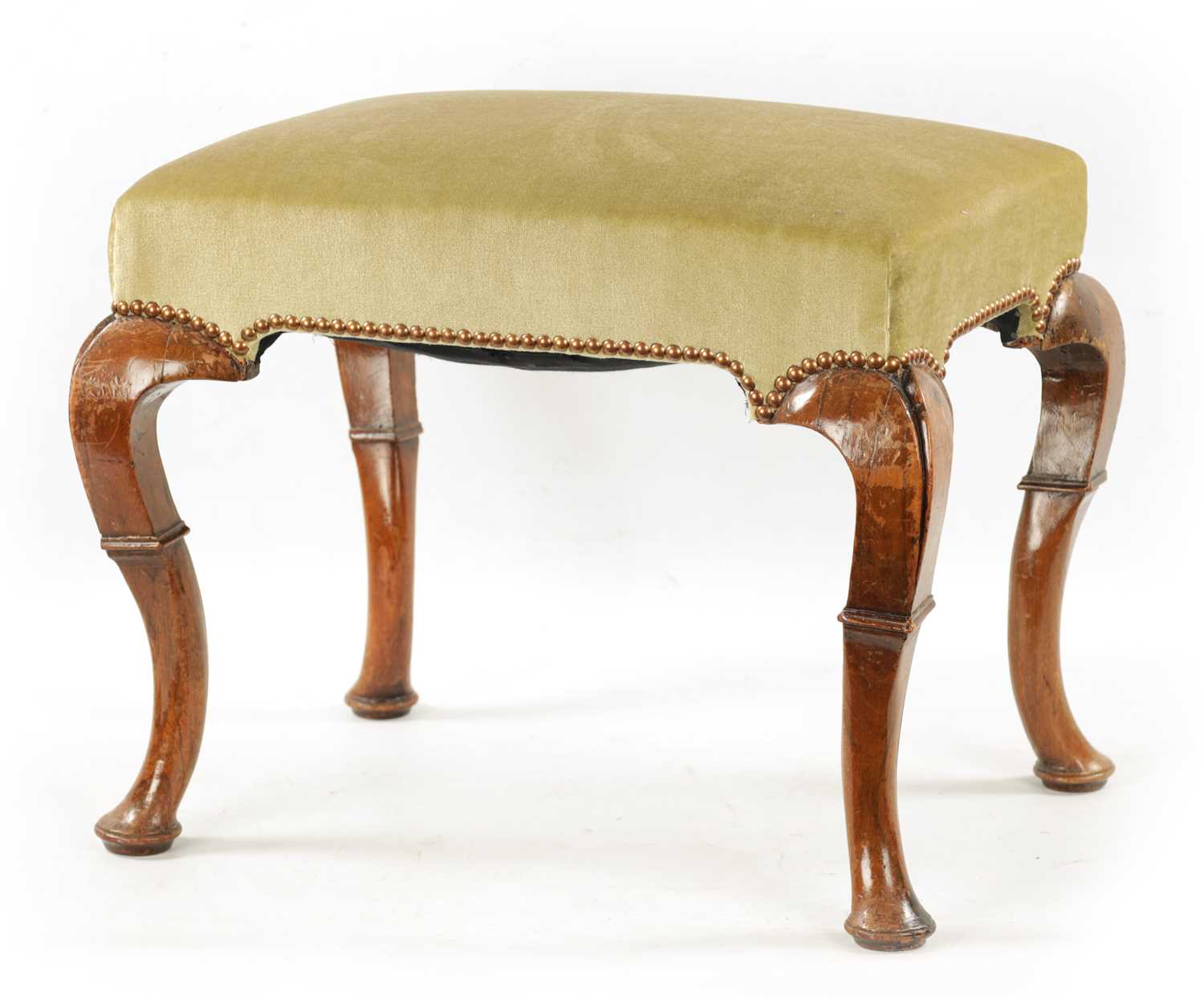 A GEORGE I WALNUT UPHOLSTERED STOOL