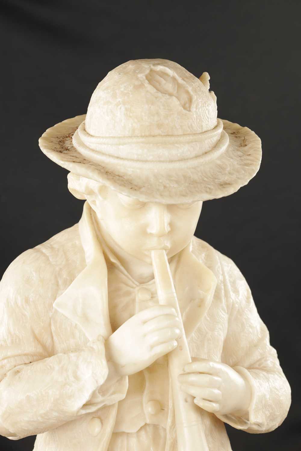 A 19TH CENTURY CARVED ALABASTER FIGURE OF A BOY PLAYING AN INSTRUMENT - Image 3 of 9