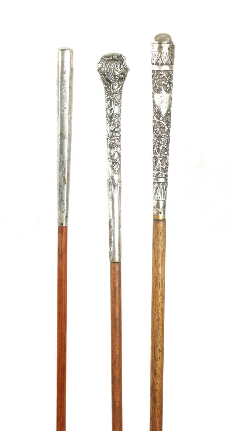 A COLLECTION OF THREE 19TH CENTURY LONG HANDLED SILVER TOPPED WALKING STICKS