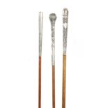 A COLLECTION OF THREE 19TH CENTURY LONG HANDLED SILVER TOPPED WALKING STICKS