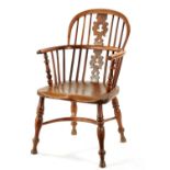 AN EARLY 19TH CENTURY NOTTINGHAMSHIRE YEW-WOOD LOW BACK WINDSOR CHAIR