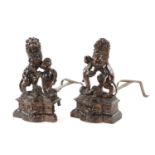 A PAIR OF 19TH CENTURY BRONZE SCULPTURED CHENETS