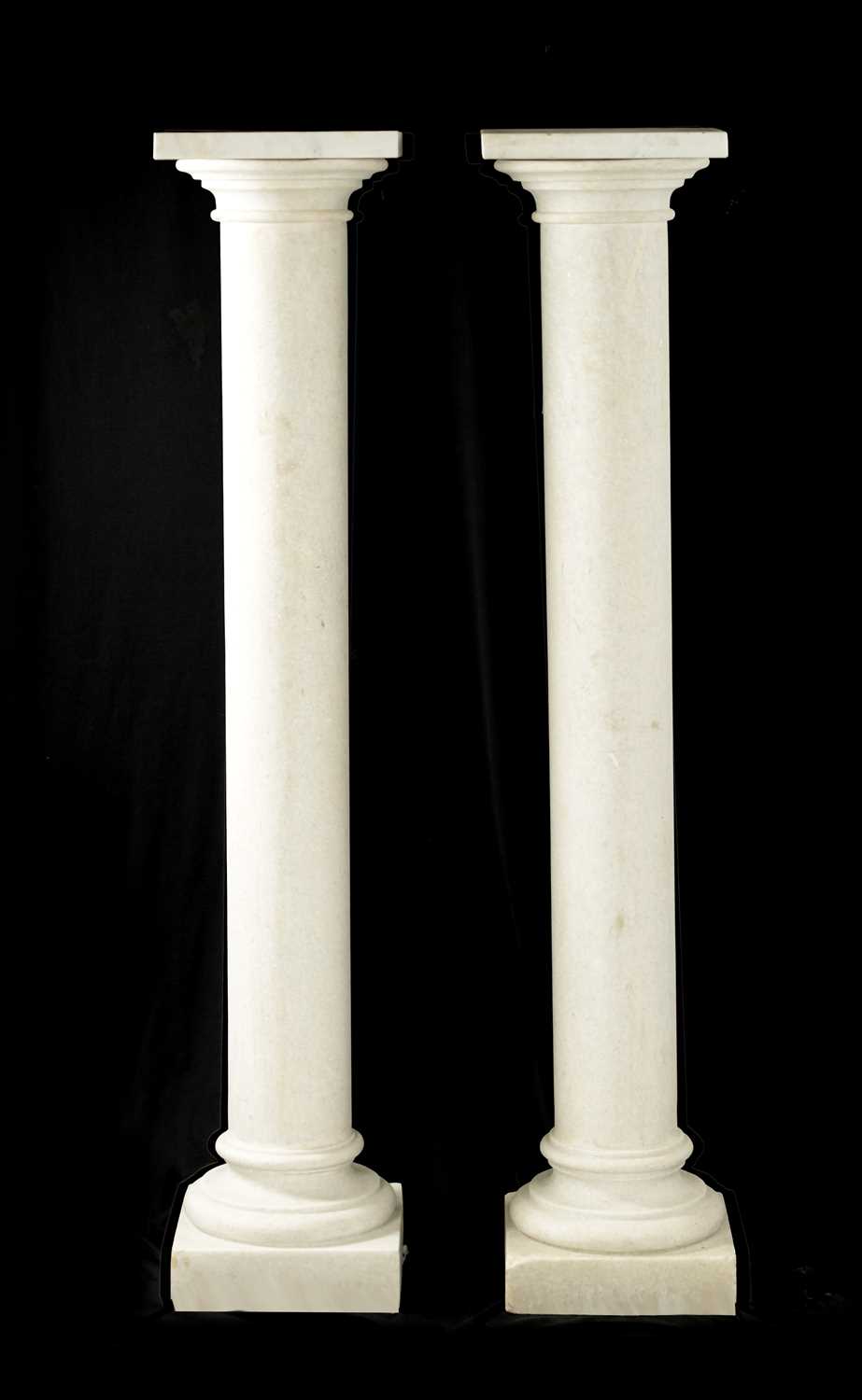 A LARGE PAIR OF WHITE MARBLE COLUMNS