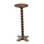 A RARE LATE 17TH CENTURY OAK BOBBIN STEM CANDLE STAND