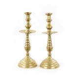 A LARGE PAIR OF 18TH CENTURY BRASS CANDLESTICKS