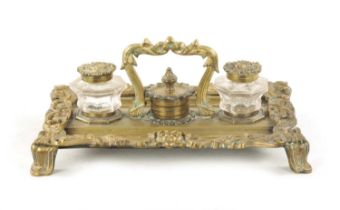 A 19TH CENTURY BRASS ROCOCO INK STAND