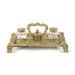 A 19TH CENTURY BRASS ROCOCO INK STAND