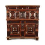 A 17TH CENTURY TWO PART MOULDED FRONT YEW-WOOD, WALNUT AND EBONY CHEST OF DRAWERS