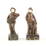 A PAIR OF ARTS AND CRAFTS BRONZE AND IVORY FIGURES