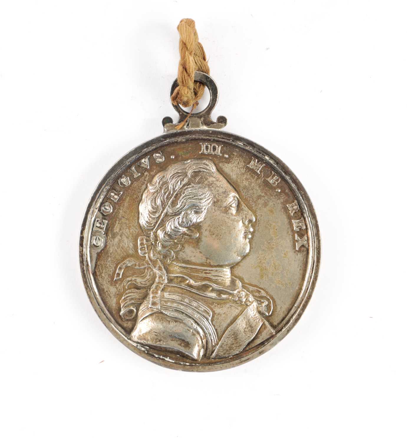 A LARGE GEORGE III SILVER CARIB WAR MEDAL 1773