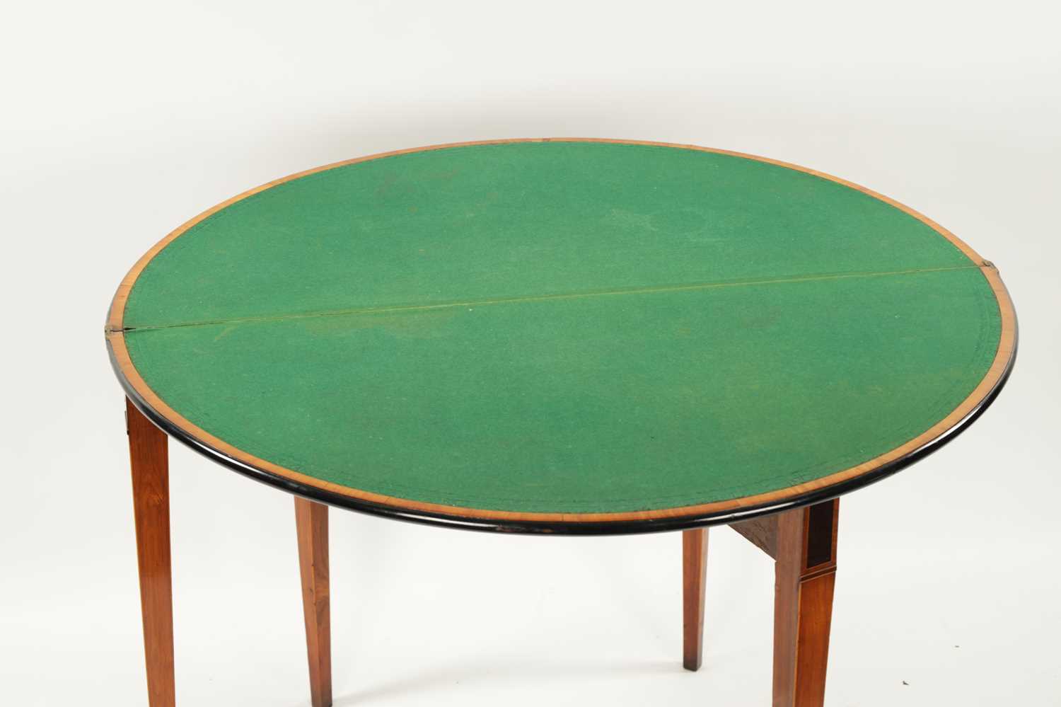 A GEORGE III SATINWOOD AND INLAID EBONISED DEMI LUNE FOLD OVER CARD TABLE - Image 9 of 10