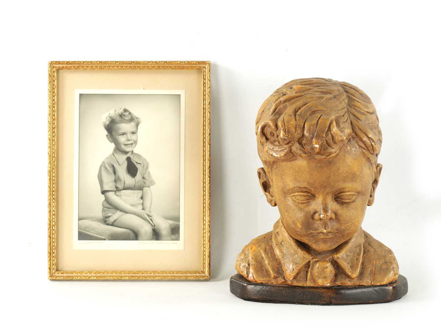 A 20TH CENTURY POTTERY BUST OF ALFRED FRANCES OBE AS A CHILD
