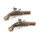 A PAIR OF 18TH CENTURY BRASS MOUNTED SPANISH FLINTLOCK PISTOLS