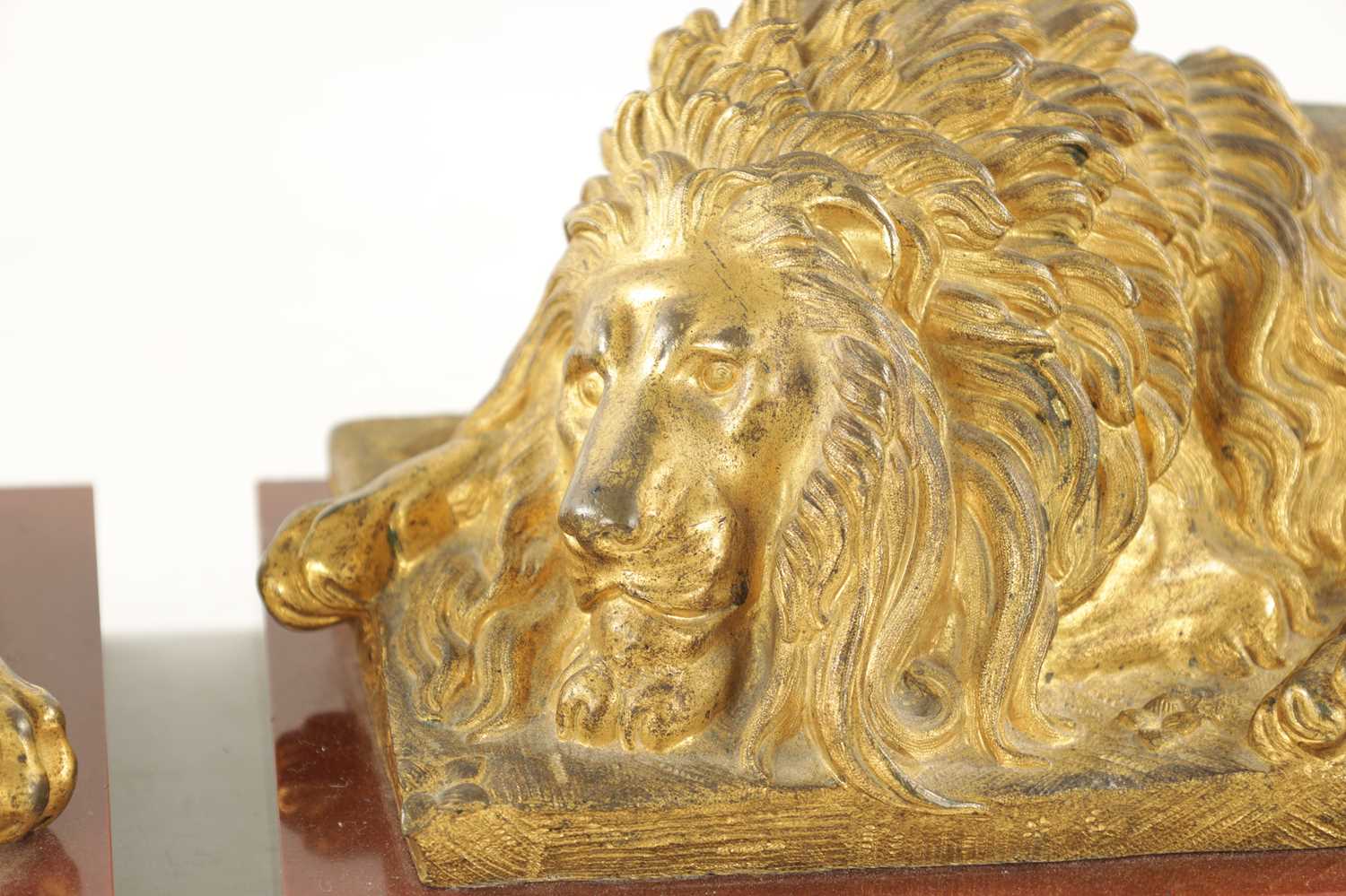 A PAIR OF LATE 19TH CENTURY GILT BRONZE RECUMBENT LIONS - Image 5 of 11