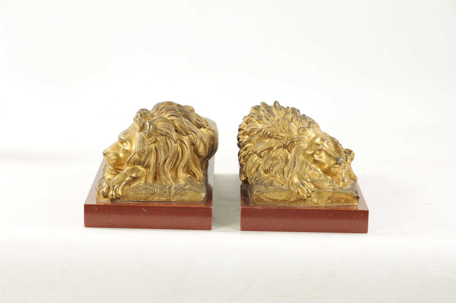 A PAIR OF LATE 19TH CENTURY GILT BRONZE RECUMBENT LIONS - Image 9 of 11