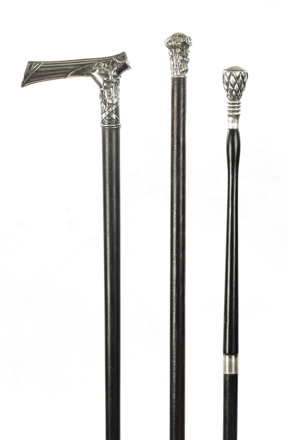 A COLLECTION OF THREE 19TH CENTURY SILVER TOPPED WALKING STICKS