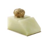 AN EDWARDIAN ONYX AND ORMOLU MOUNTED INKWELL