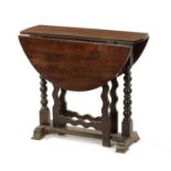 A 17TH CENTURY SMALL OAK GATE LEG TABLE WITH SILHOUETTE LEG