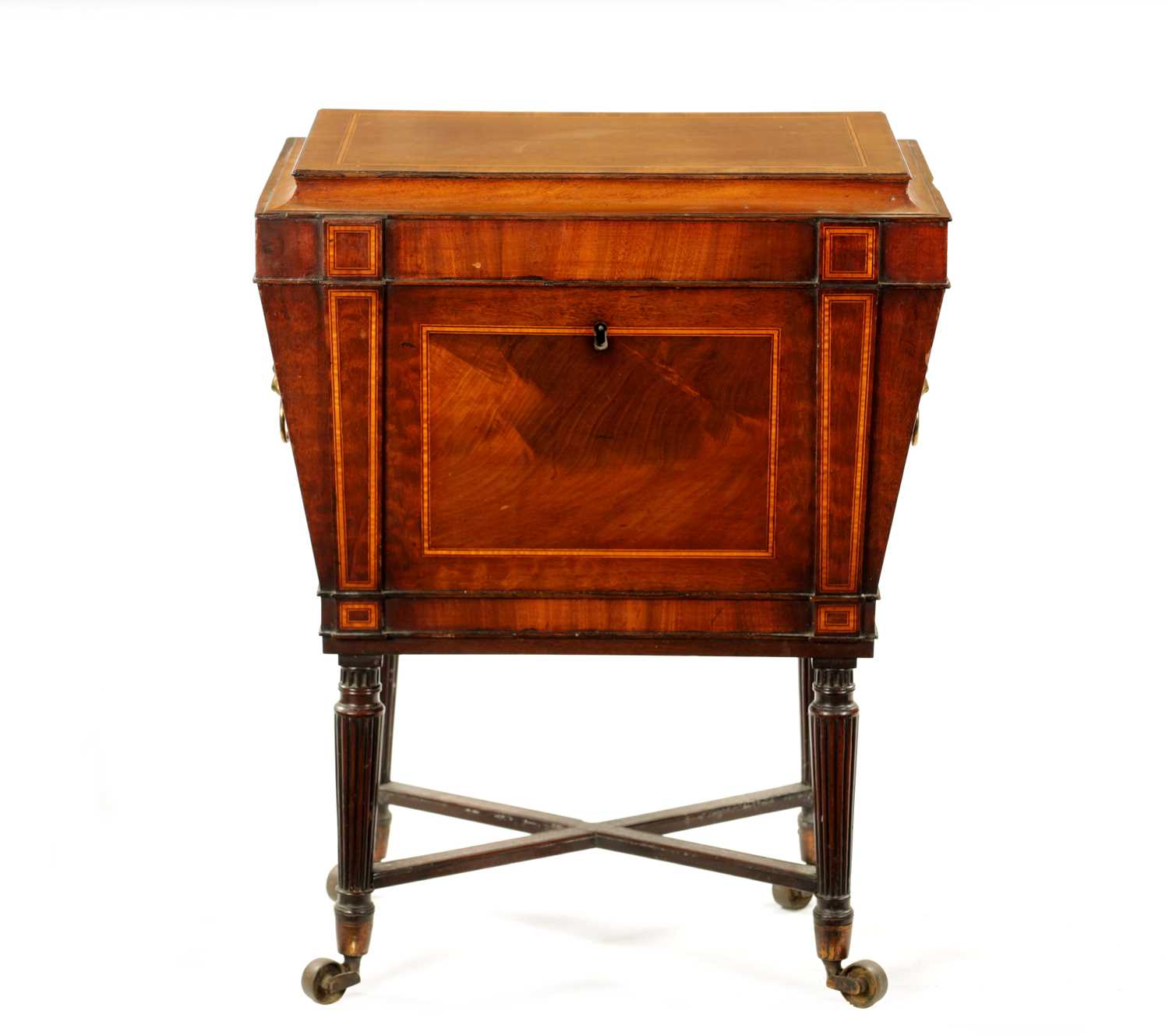 A REGENCY INLAID MAHOGANY CELLARETTE ON TAPERED FLUTED LEGS IN THE MANNER OF GILLOWS