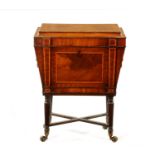A REGENCY INLAID MAHOGANY CELLARETTE ON TAPERED FLUTED LEGS IN THE MANNER OF GILLOWS