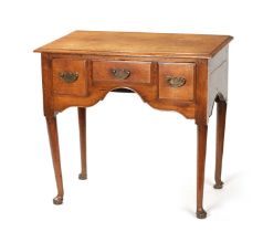 AN EARLY 18TH CENTURY OAK LOWBOY