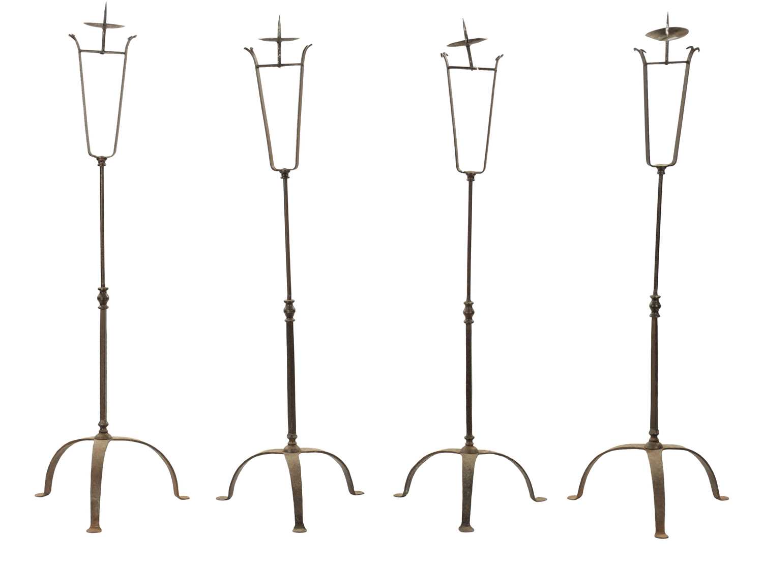 A SET OF FOUR IRONWORK CHURCH FLOOR STANDING CANDLESTICKS