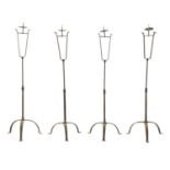 A SET OF FOUR IRONWORK CHURCH FLOOR STANDING CANDLESTICKS