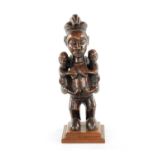 AN ANTIQUE CARVED HARDWOOD YAKA MATERNITY CONGO FIGURE