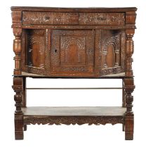 A 17TH CENTURY CARVED OAK BUFFET