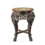 A 19TH CENTURY CHINESE HARDWOOD JARDINIERE STAND WITH CANTON PORCELAIN TOP