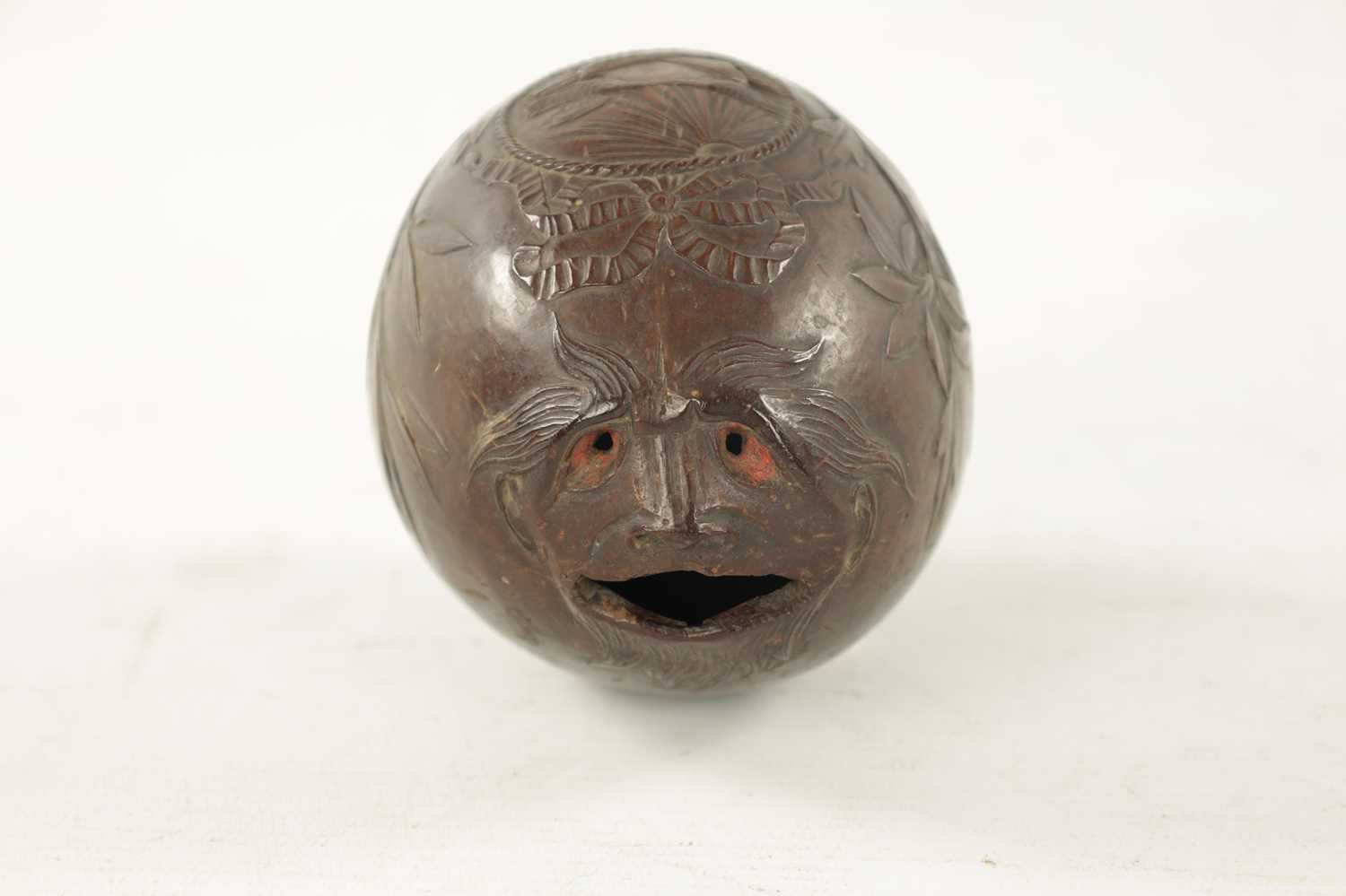 AN EARLY 19TH CENTURY EASTERN CARVED COCONUT BUGBEAR MONEYBOX - Image 2 of 4