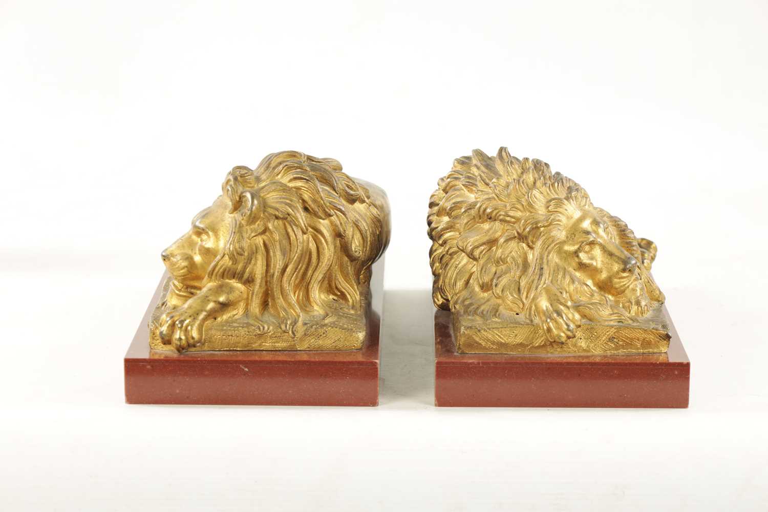 A PAIR OF LATE 19TH CENTURY GILT BRONZE RECUMBENT LIONS - Image 10 of 11