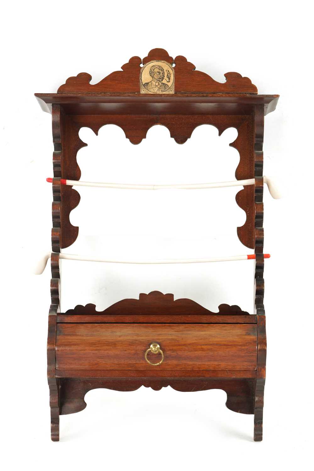 A 19TH CENTURY MAHOGANY HANGING PIPE RACK