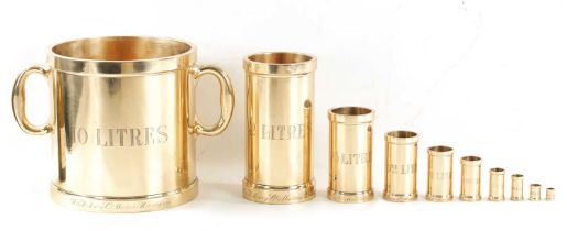 A SET OF TEN BRONZE MEASURES BY W. & J. AVERY LTD. BIRMINGHAM