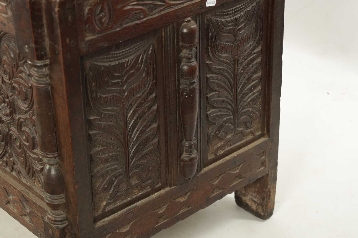 A 17TH CENTURY CARVED OAK THREE PANELLED FRONT COFFER - Image 7 of 8