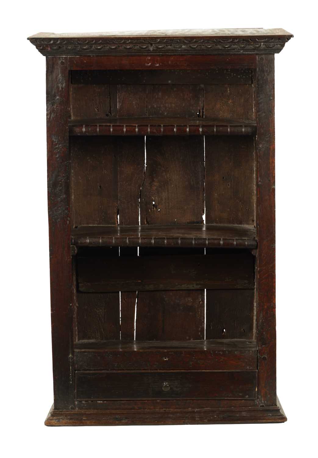 A 17TH CENTURY OAK HANGING OPEN SPICE RACK WITH FITTED DRAWER