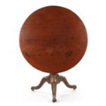 AN UNUSUAL 18TH CENTURY IRISH LARGE MAHOGANY TRIPOD TABLE WITH CARVED LEGS AND SCROLL FEET